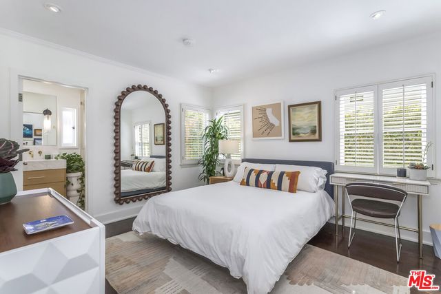 a view of room with window and wooden floor