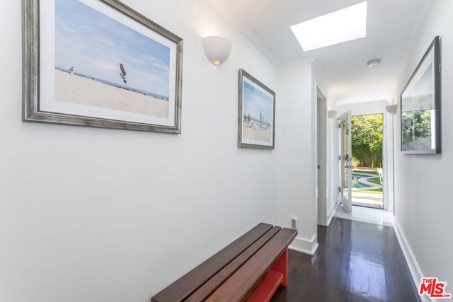 a view of a pathway of a house with wooden floor
