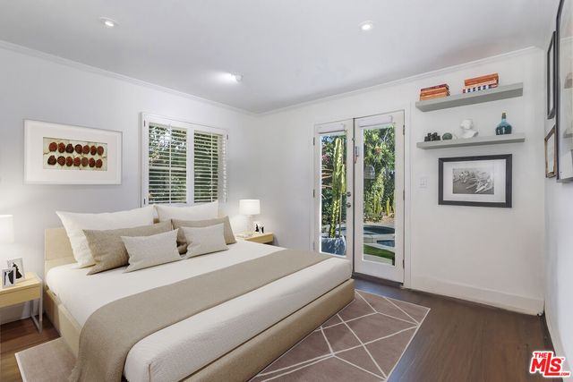 a living room with furniture kitchen view and a table