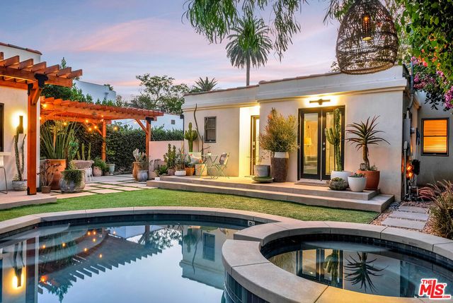 a view of a house with swimming pool