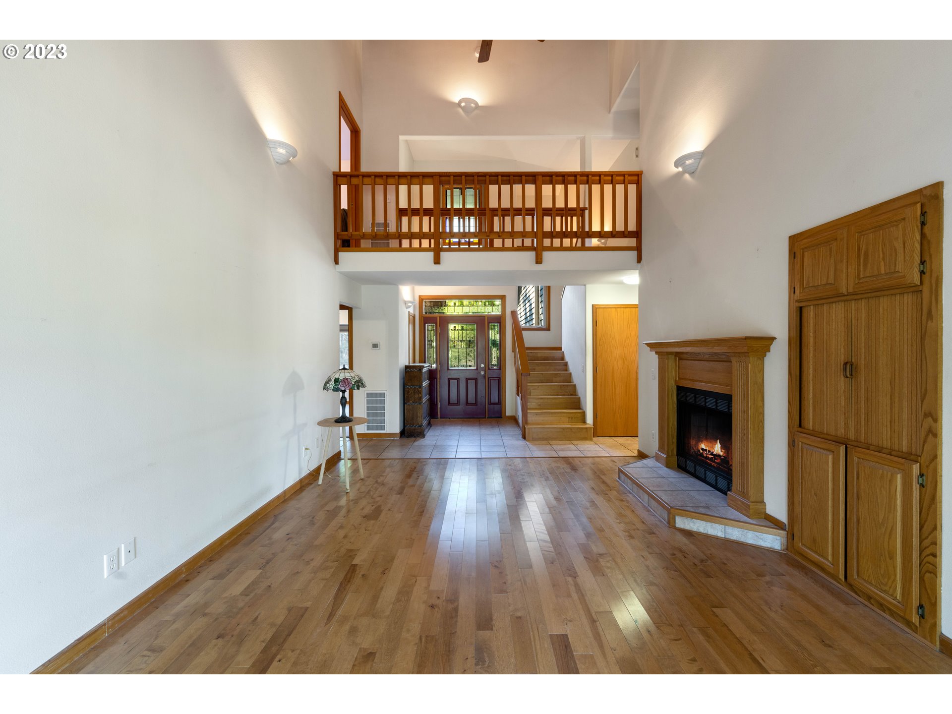 87268 Ruby Lane Bandon, OR 97411 - Photo 17 of 47 a view of a livingroom with wooden floor and a fireplace