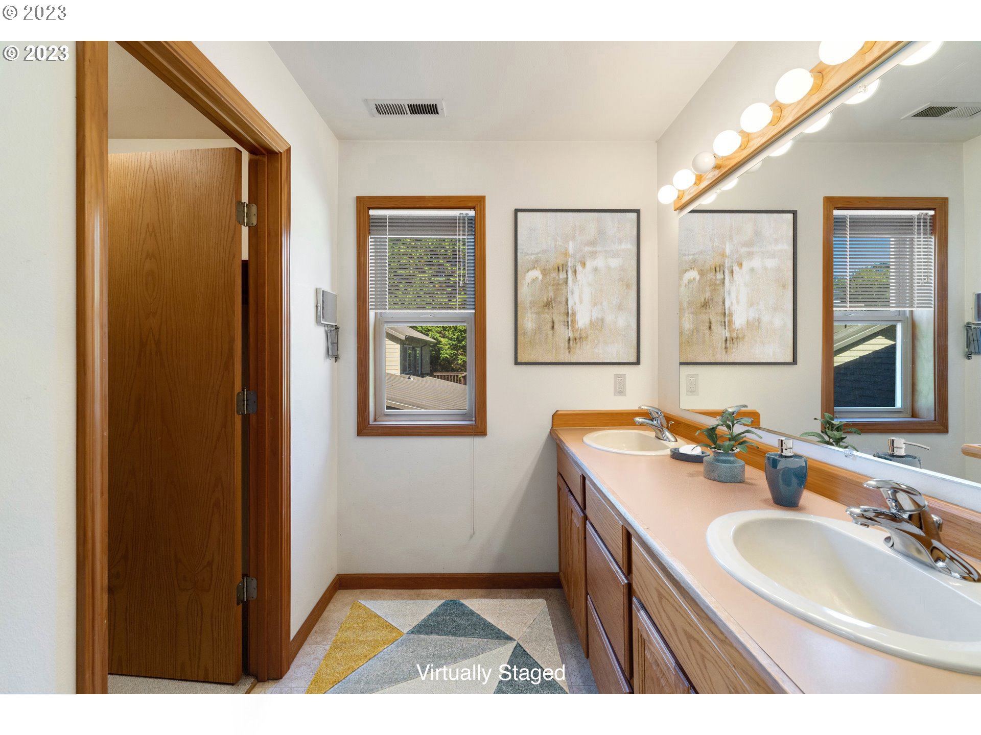87268 Ruby Lane Bandon, OR 97411 - Photo 29 of 47 a bathroom with a sink double vanity and a mirror