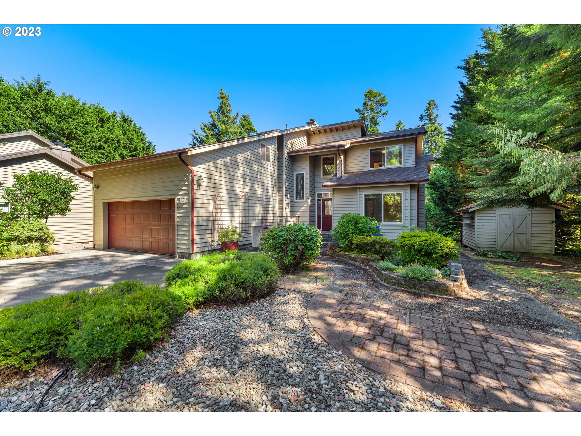 87268 Ruby Lane Bandon, OR 97411 - Photo 43 of 47 a front view of a house with garden