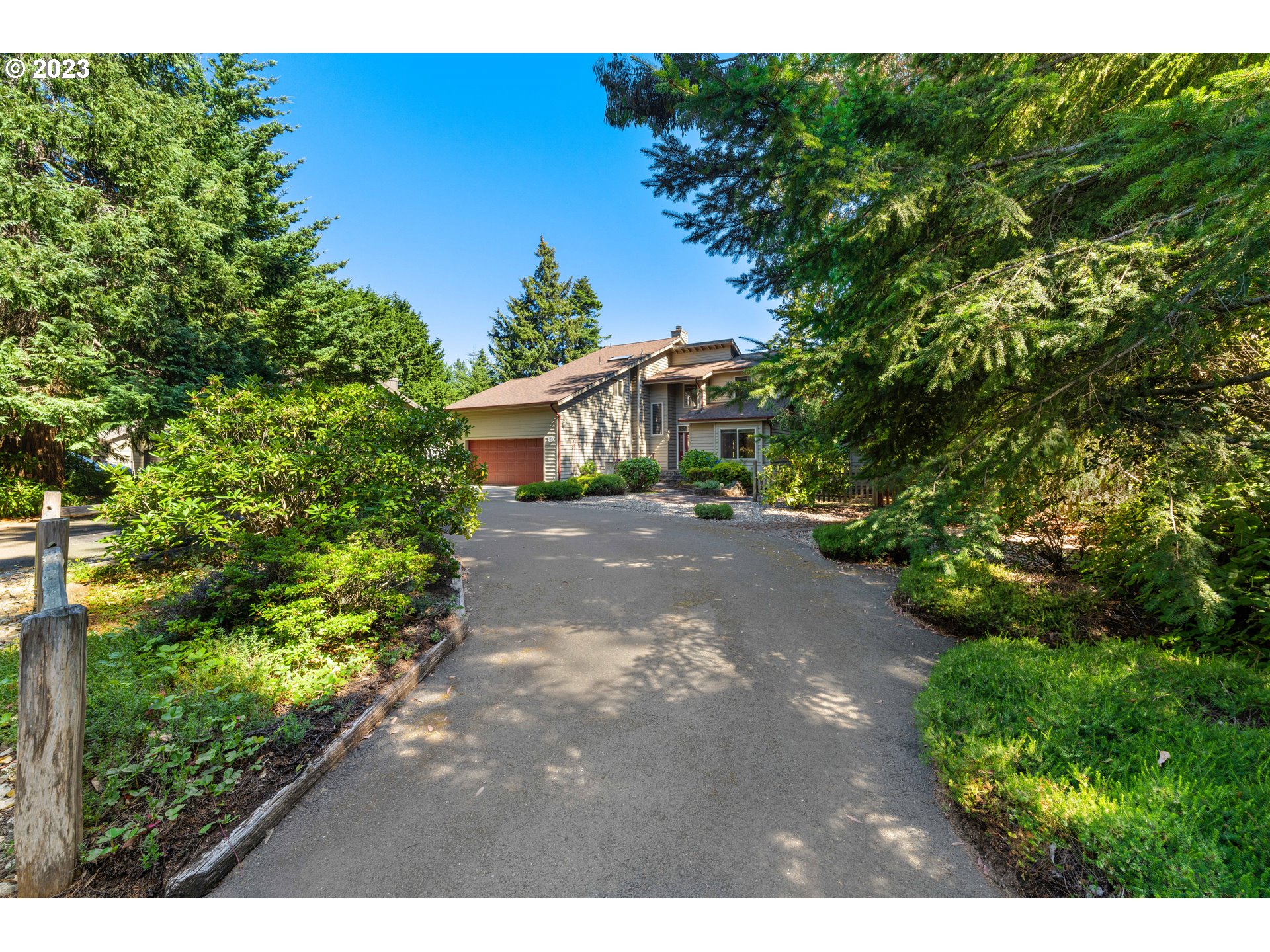 87268 Ruby Lane Bandon, OR 97411 - Photo 45 of 47 a view of an outdoor space with a house in background