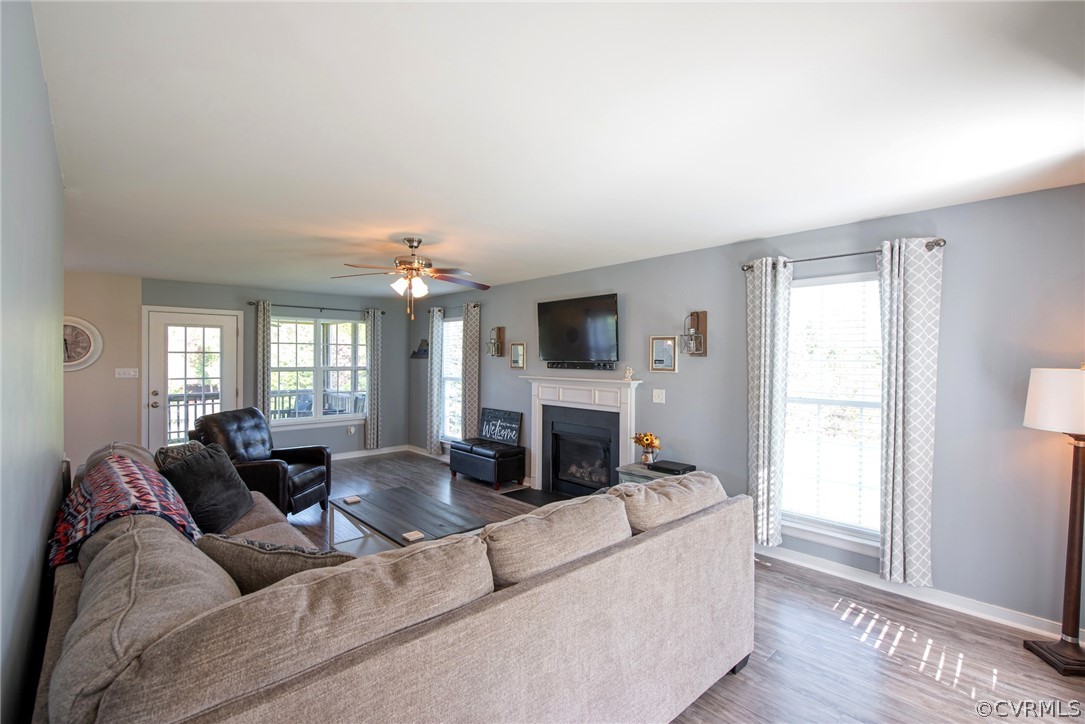 552 Waltons Store Road Louisa, VA 23093 - Photo 19 of 50 a living room with furniture a fireplace and a flat screen tv