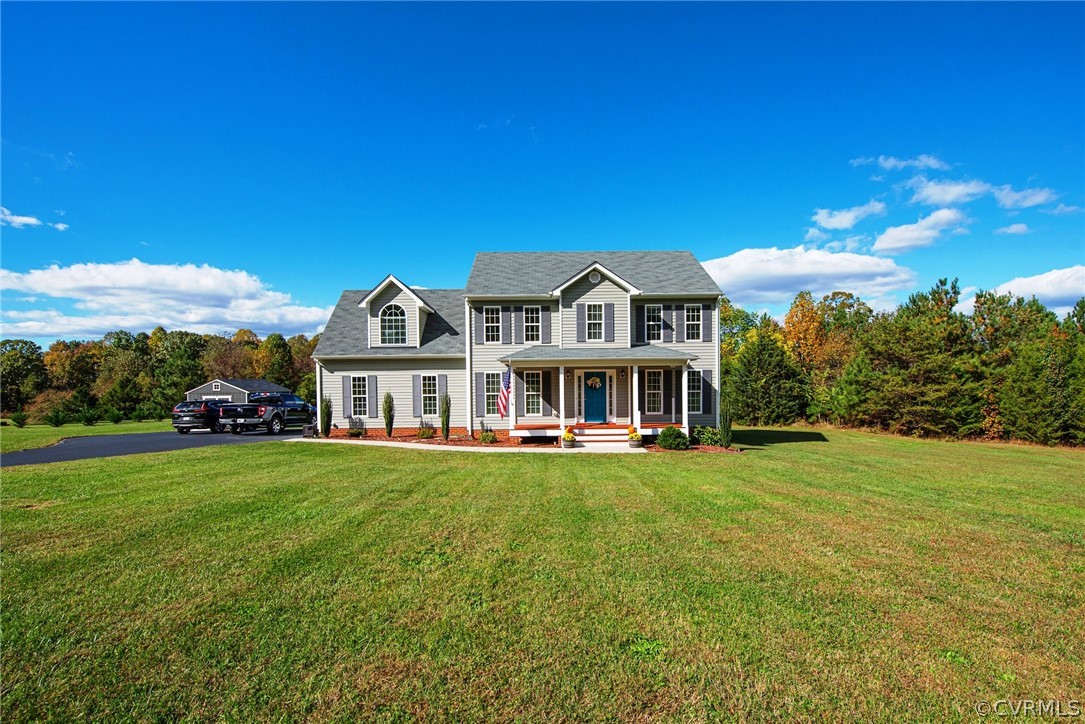 552 Waltons Store Road Louisa, VA 23093 - Photo 2 of 50 a front view of a house with a garden and yard