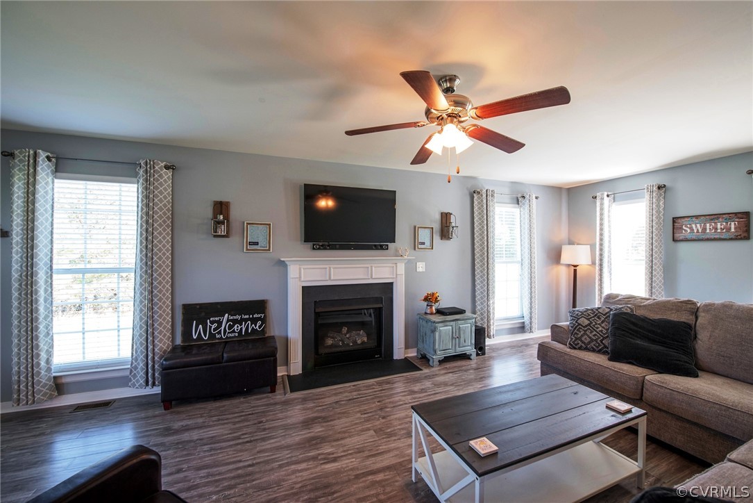 552 Waltons Store Road Louisa, VA 23093 - Photo 21 of 50 a living room with furniture a fireplace and a flat screen tv