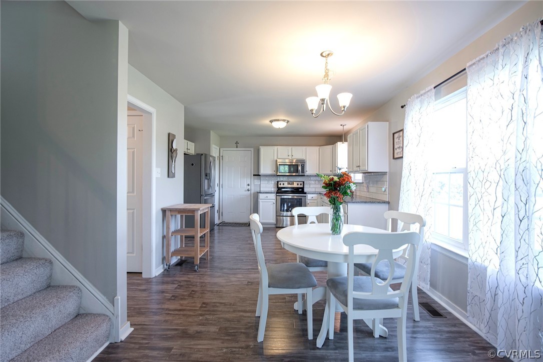 552 Waltons Store Road Louisa, VA 23093 - Photo 24 of 50 a view of a dining room with furniture window and wooden floor