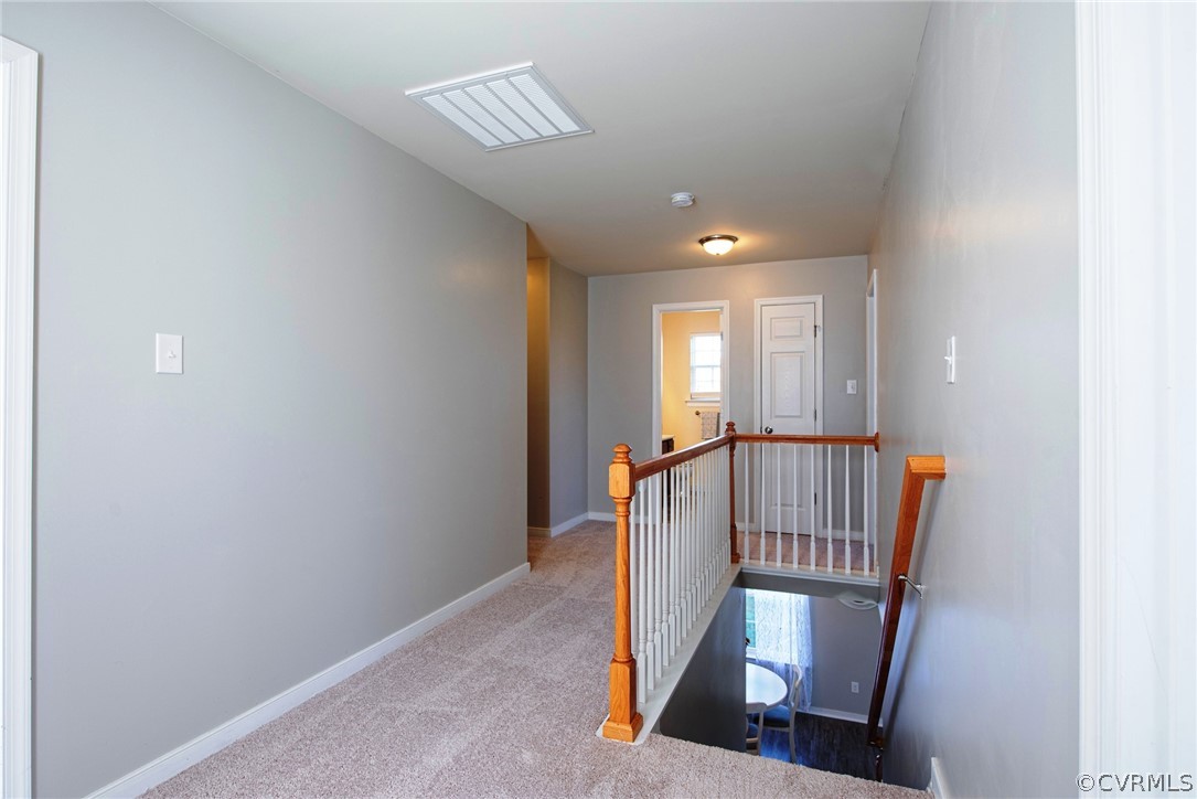 552 Waltons Store Road Louisa, VA 23093 - Photo 32 of 50 a view of a hallway with windows and stairs