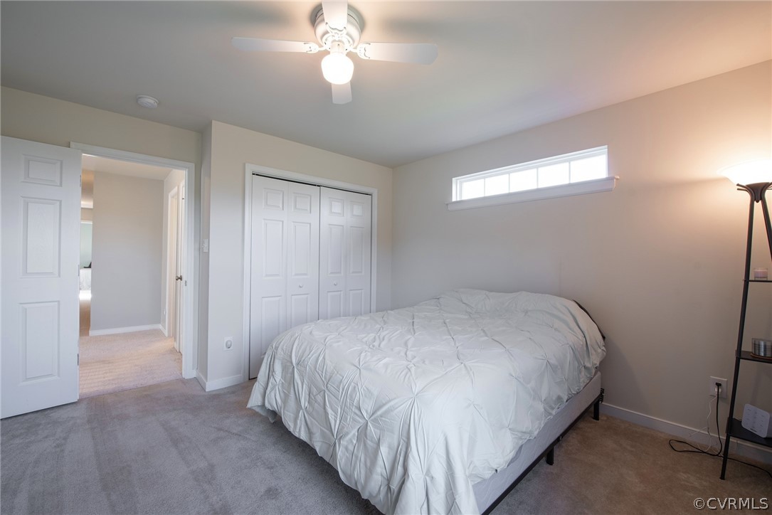 552 Waltons Store Road Louisa, VA 23093 - Photo 41 of 50 a bedroom with a bed and a chandelier
