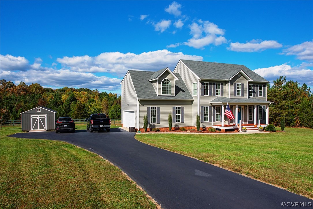 552 Waltons Store Road Louisa, VA 23093 - Photo 5 of 50 a view of a big house with a big yard and potted plants
