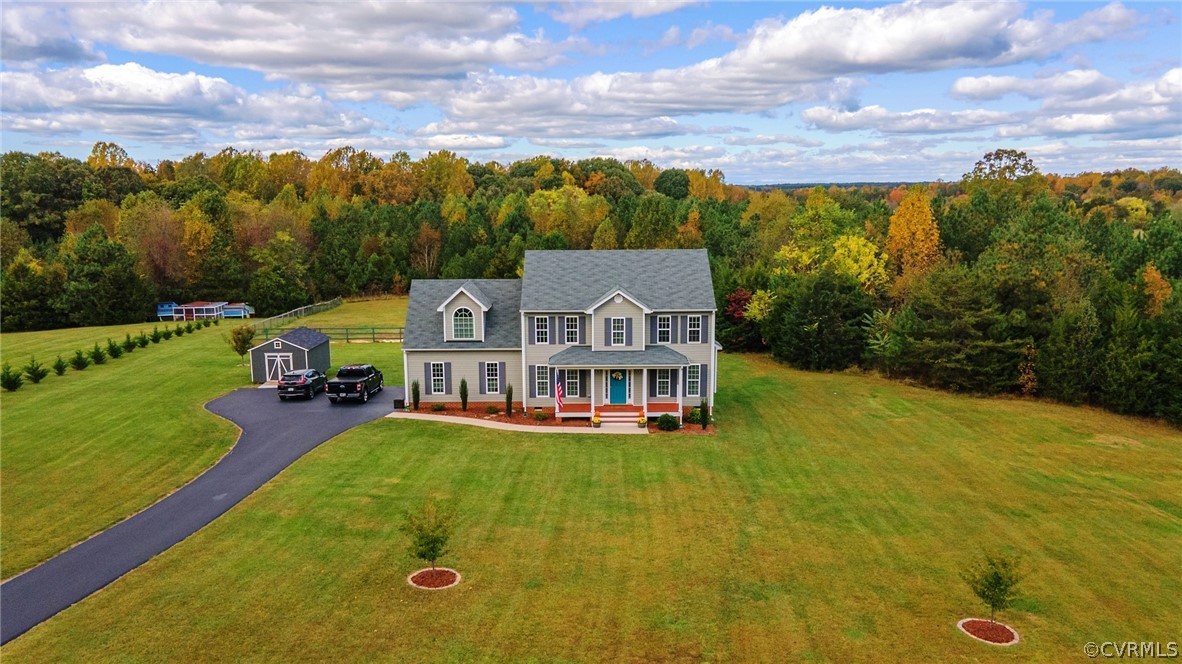 552 Waltons Store Road Louisa, VA 23093 - Photo 7 of 50 a view of a house with a big yard and large trees