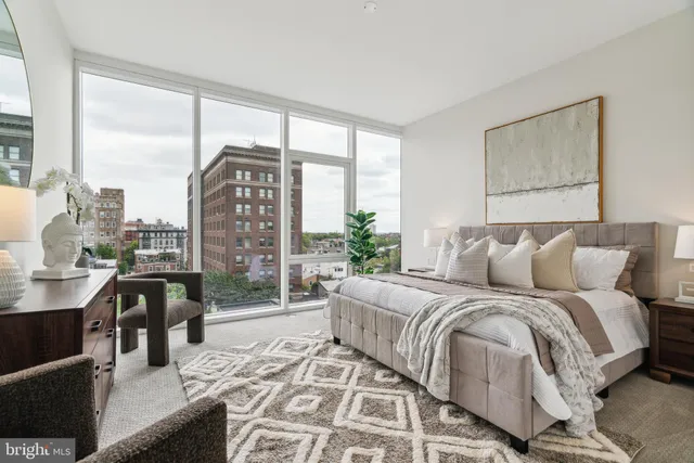 a bedroom with a bed and a desk