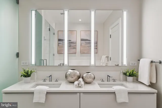 a white bath tub sitting next to a white sink