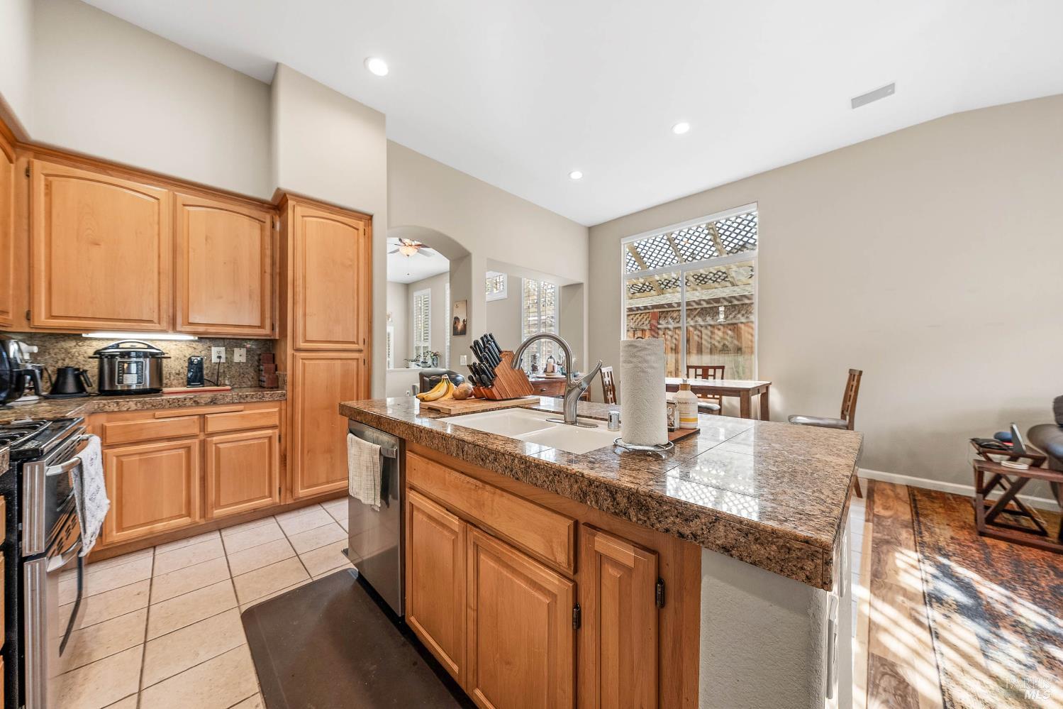 2545 Thistle Creek Street Santa Rosa, CA 95404 - Photo 18 of 59 a kitchen with stainless steel appliances granite countertop a stove a sink and a refrigerator