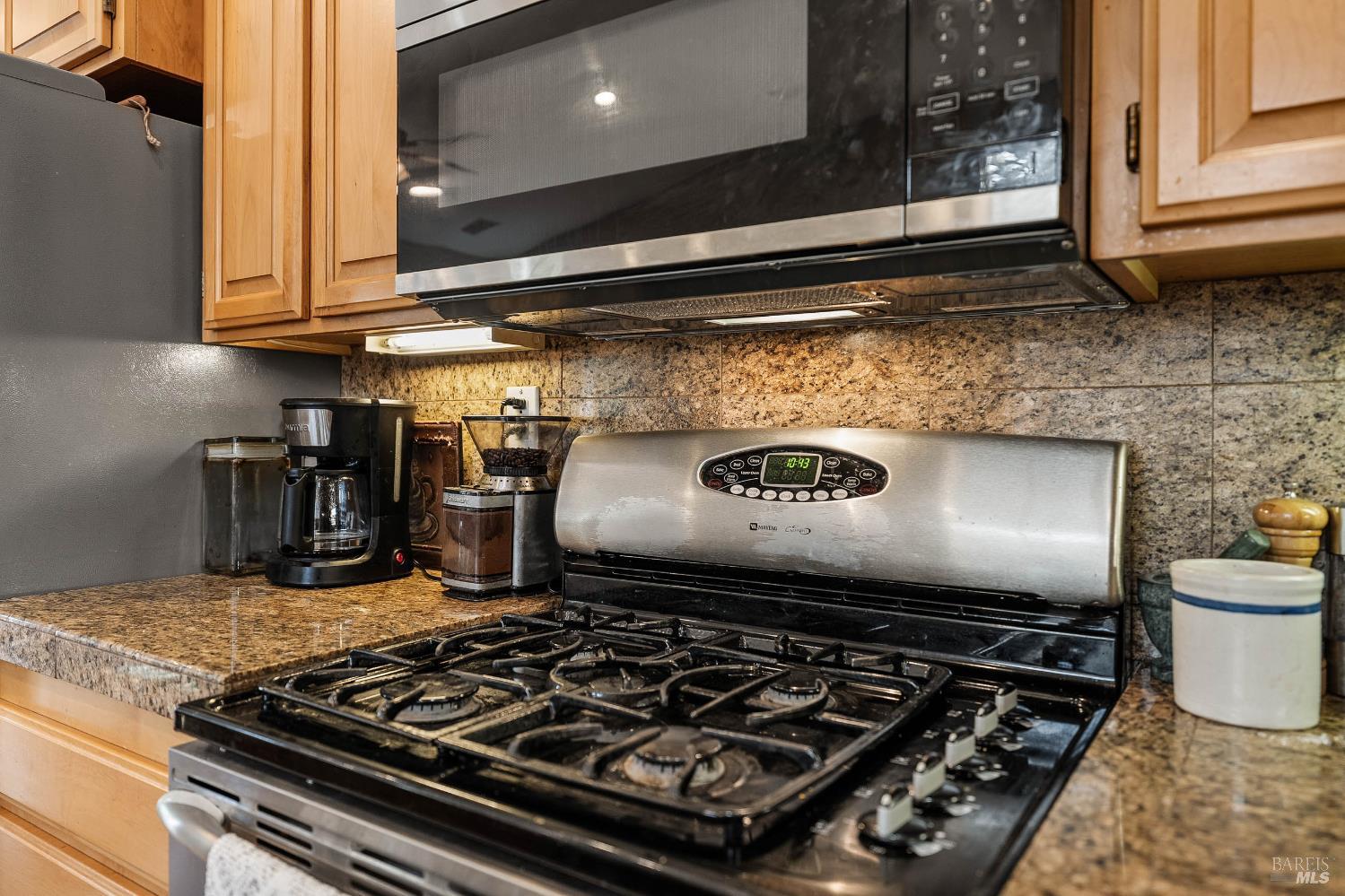 2545 Thistle Creek Street Santa Rosa, CA 95404 - Photo 20 of 59 a stove top oven sitting inside of a kitchen