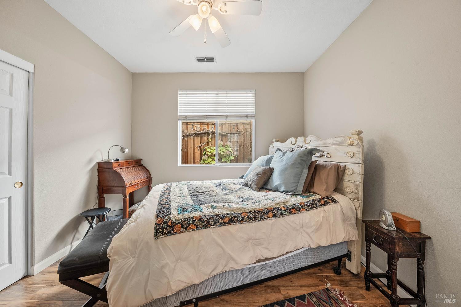 2545 Thistle Creek Street Santa Rosa, CA 95404 - Photo 31 of 59 a bedroom with a bed and wooden floor