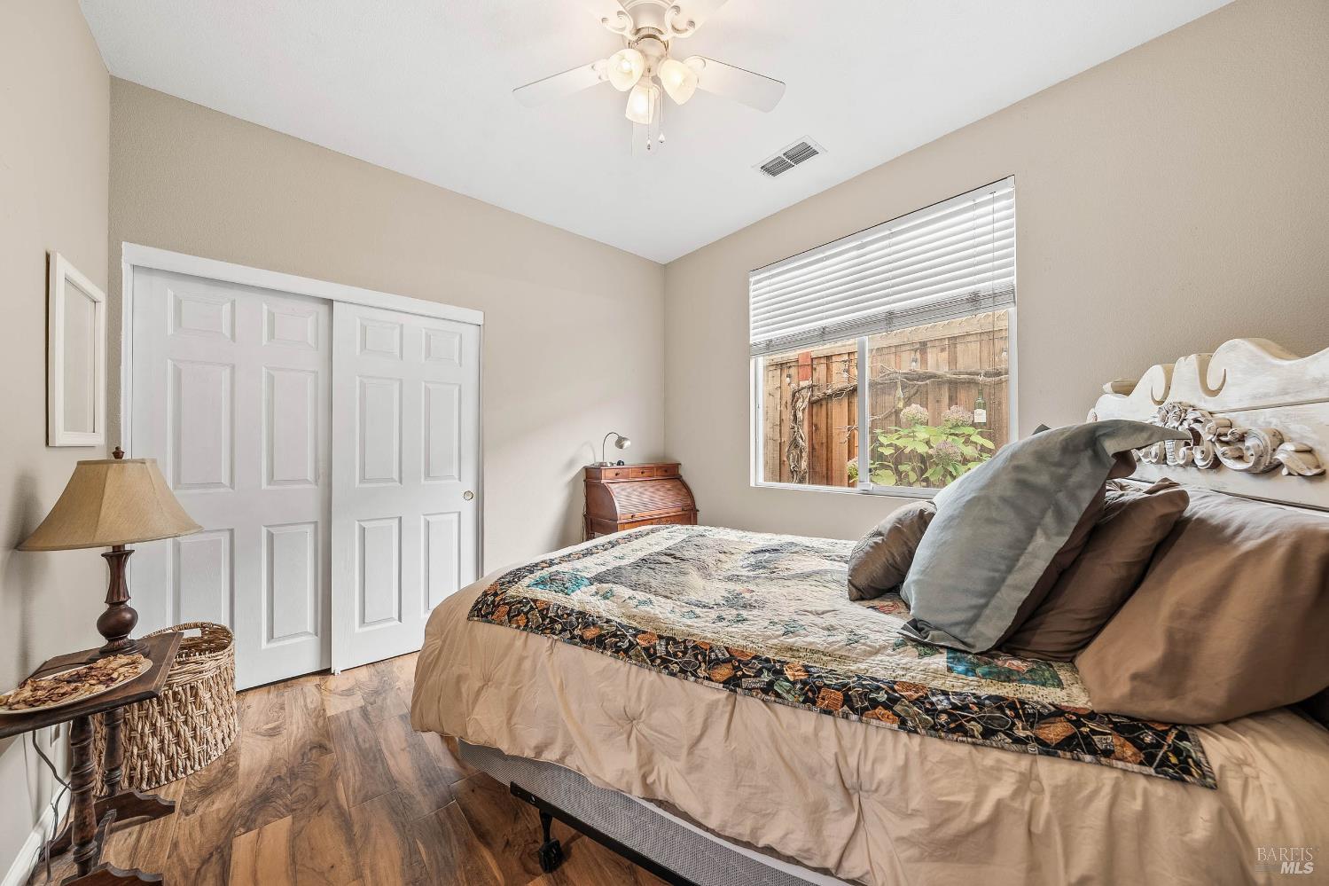 2545 Thistle Creek Street Santa Rosa, CA 95404 - Photo 33 of 59 a bedroom with a bed and a chandelier