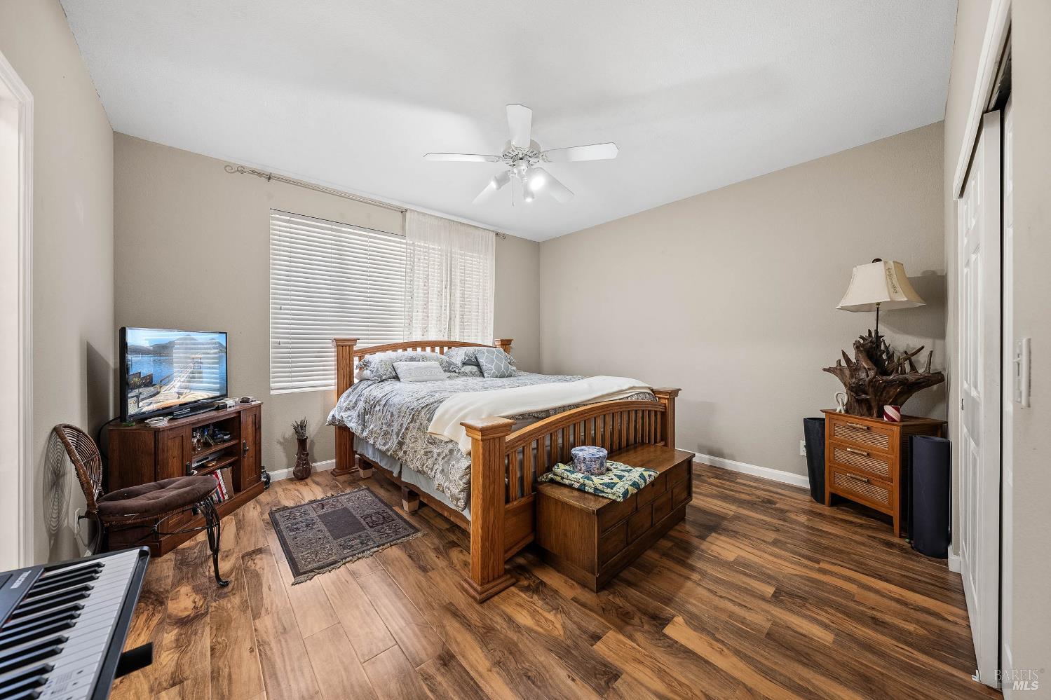 2545 Thistle Creek Street Santa Rosa, CA 95404 - Photo 35 of 59 a bedroom with bed table and a flat screen tv