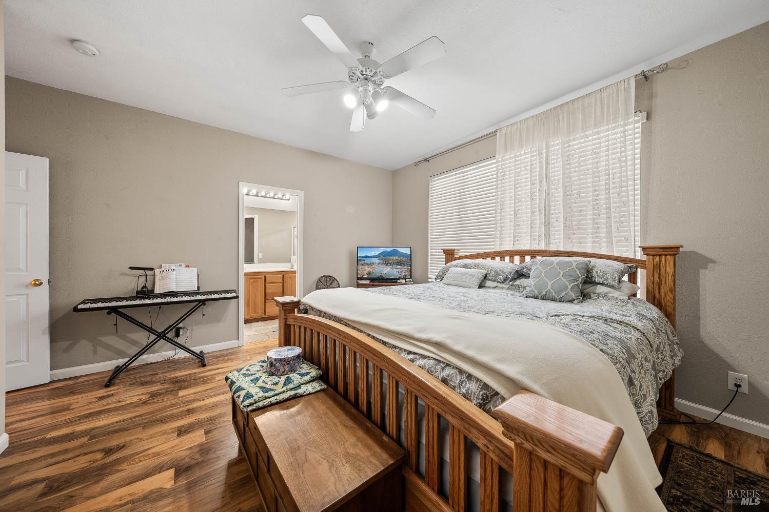 2545 Thistle Creek Street Santa Rosa, CA 95404 - Photo 36 of 59 a bedroom with a bed and a table in it