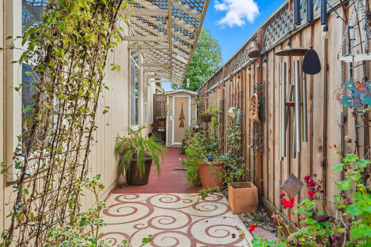 2545 Thistle Creek Street Santa Rosa, CA 95404 - Photo 44 of 59 a potted plant sitting in front of a house