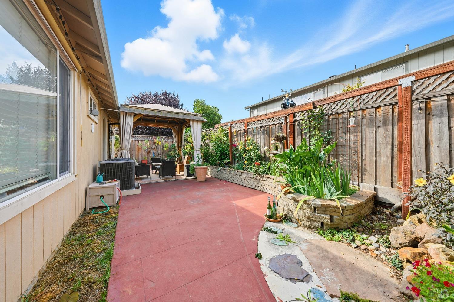 2545 Thistle Creek Street Santa Rosa, CA 95404 - Photo 49 of 59 a view of a porch with chairs and a potted plant