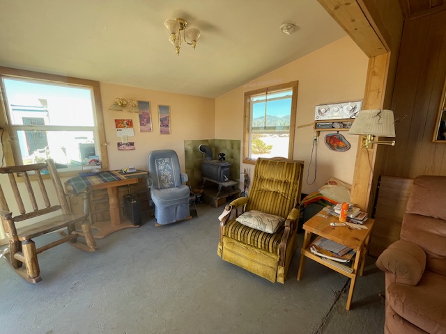 13950 Howard Road Yucca, AZ 86438 - Photo 13 of 47 Sitting room featuring vaulted ceiling and carpet