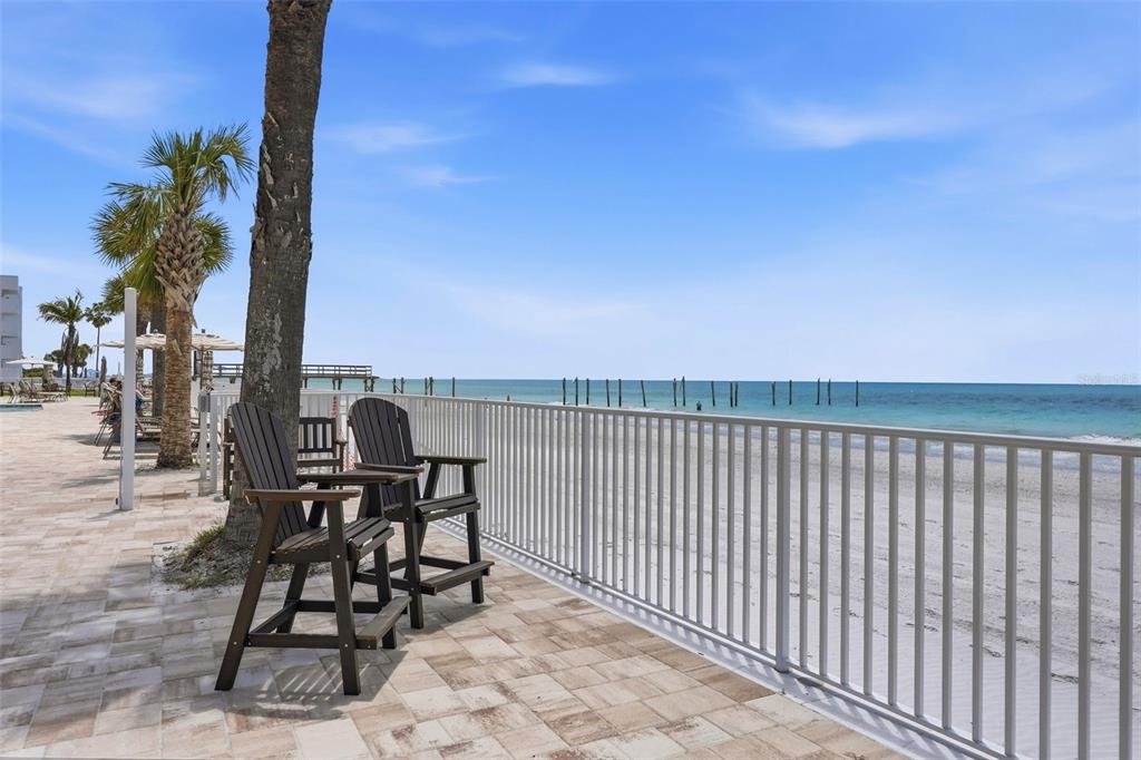 16326 Gulf Boulevard, Unit 307 Redington Beach, FL 33708 - Photo 42 of 43 a terrace with outdoor seating and city view