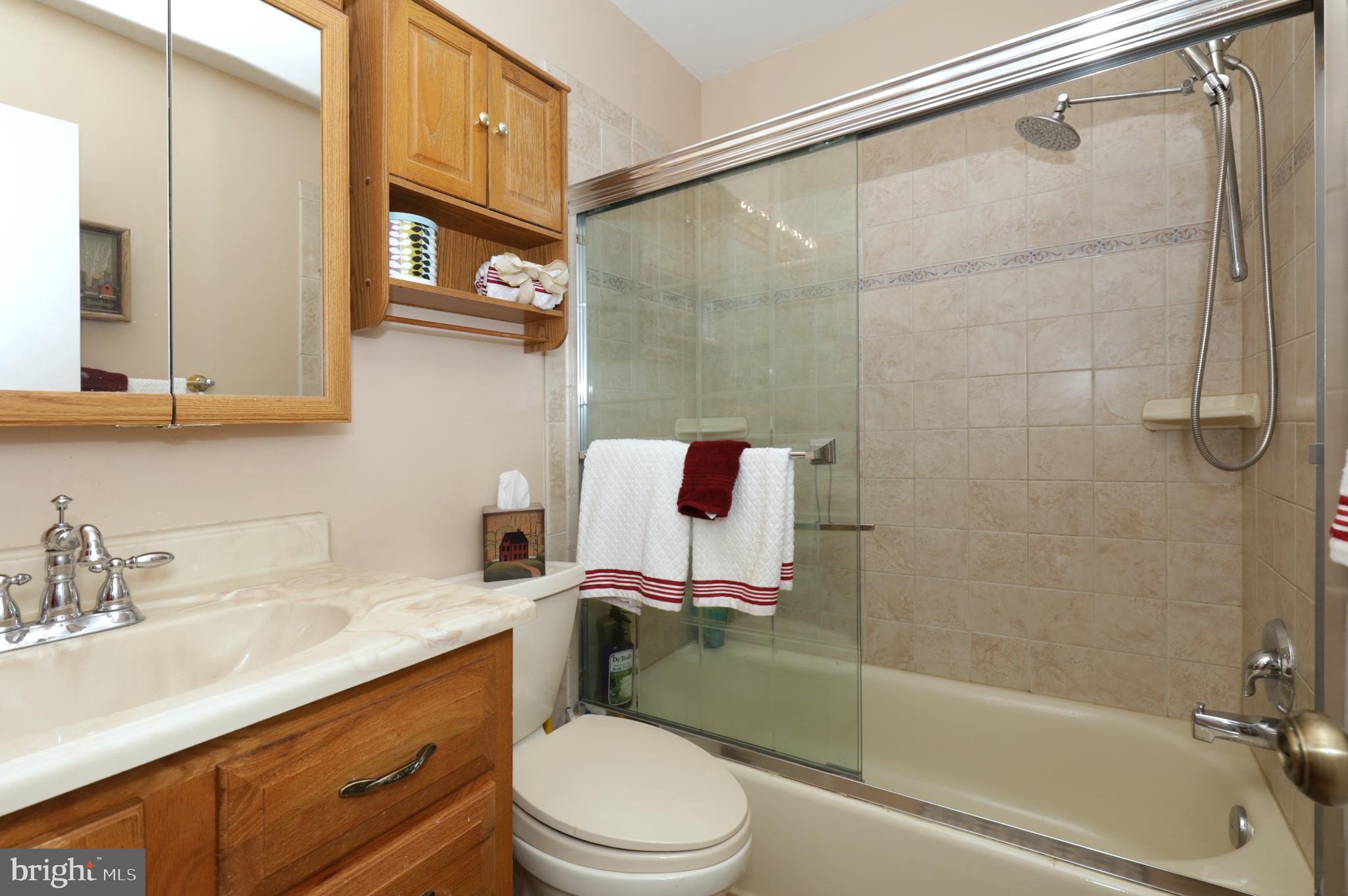 8611 Weems Road Manassas, VA 20110 - Photo 21 of 46 Upstairs Hall Bath w/ Ceramic Tile and Glass Doors