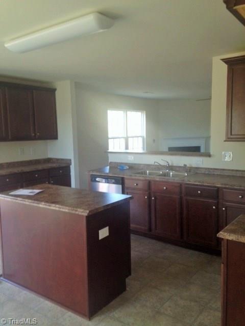 Kitchen. This picture is not of the actual home but is of the same plan. It is to demonstrate spacing and size only. Colors and options may vary from actual home which is under construction.