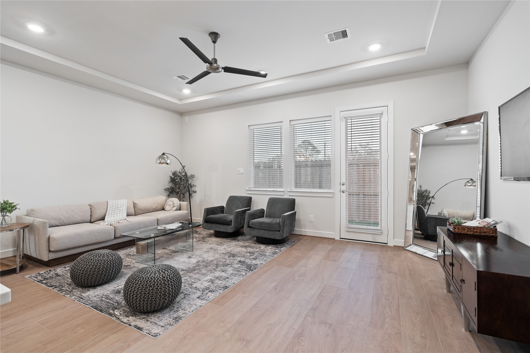 6503 Rena Street Houston, TX 77092 - Photo 14 of 33 Large rear windows keep the room bright while maintaining a clean, uncluttered wall line.