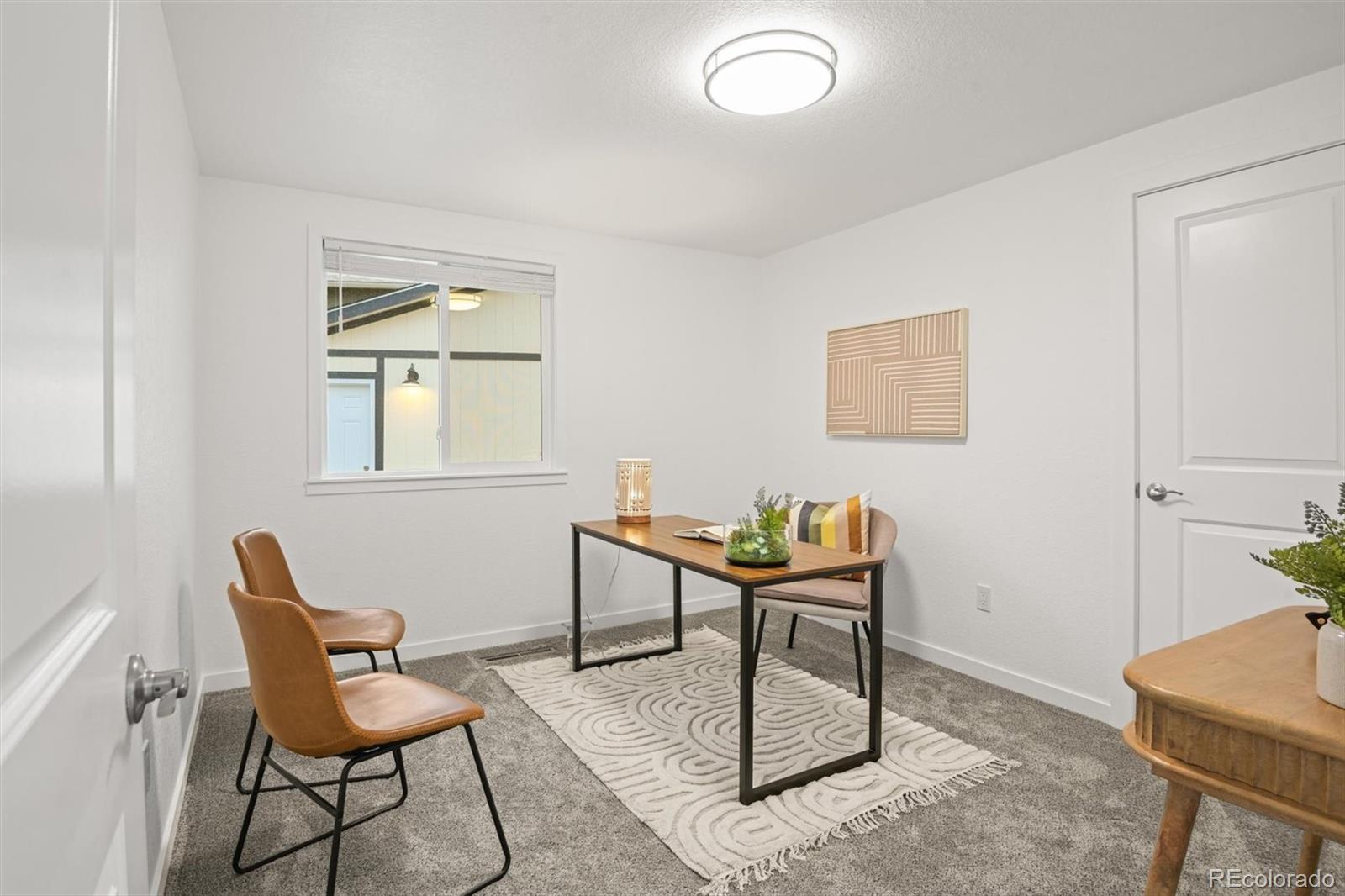 9340 Pierce Street Westminster, CO 80021 - Photo 15 of 29 a work room with furniture and a window