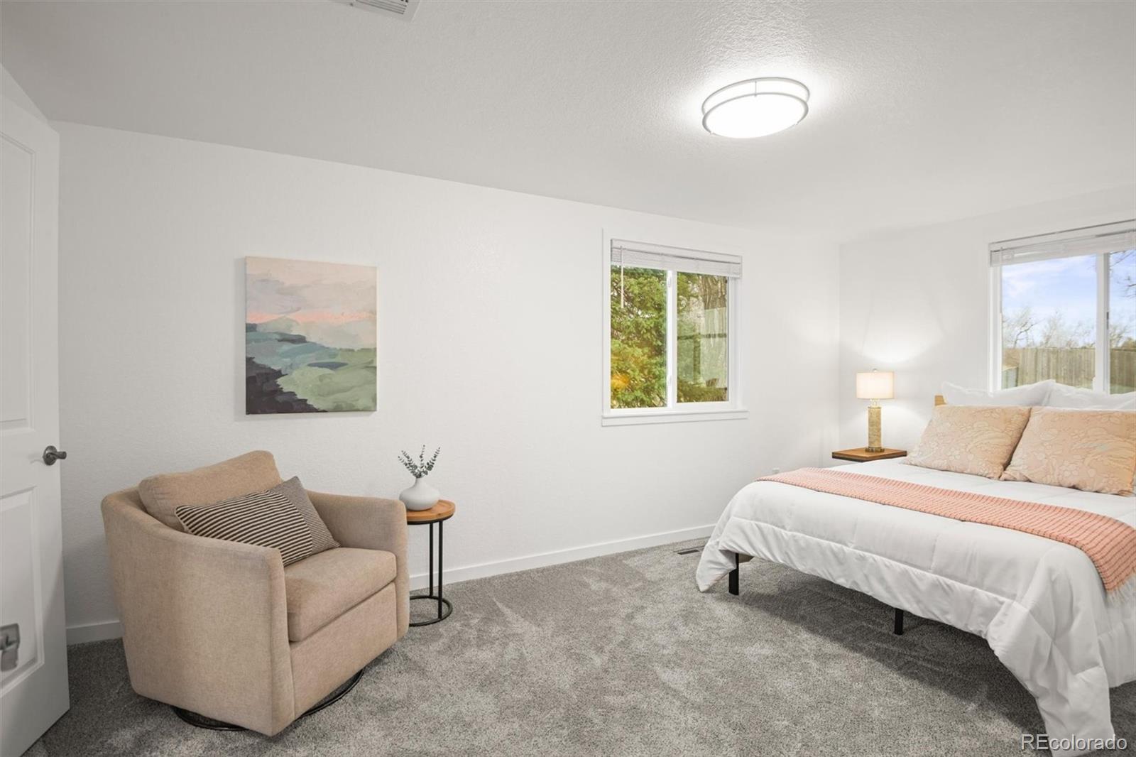 9340 Pierce Street Westminster, CO 80021 - Photo 18 of 29 a bedroom with a bed and a couch