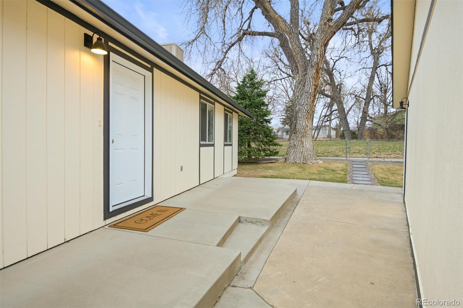 9340 Pierce Street Westminster, CO 80021 - Photo 27 of 29 a view of backyard with tree
