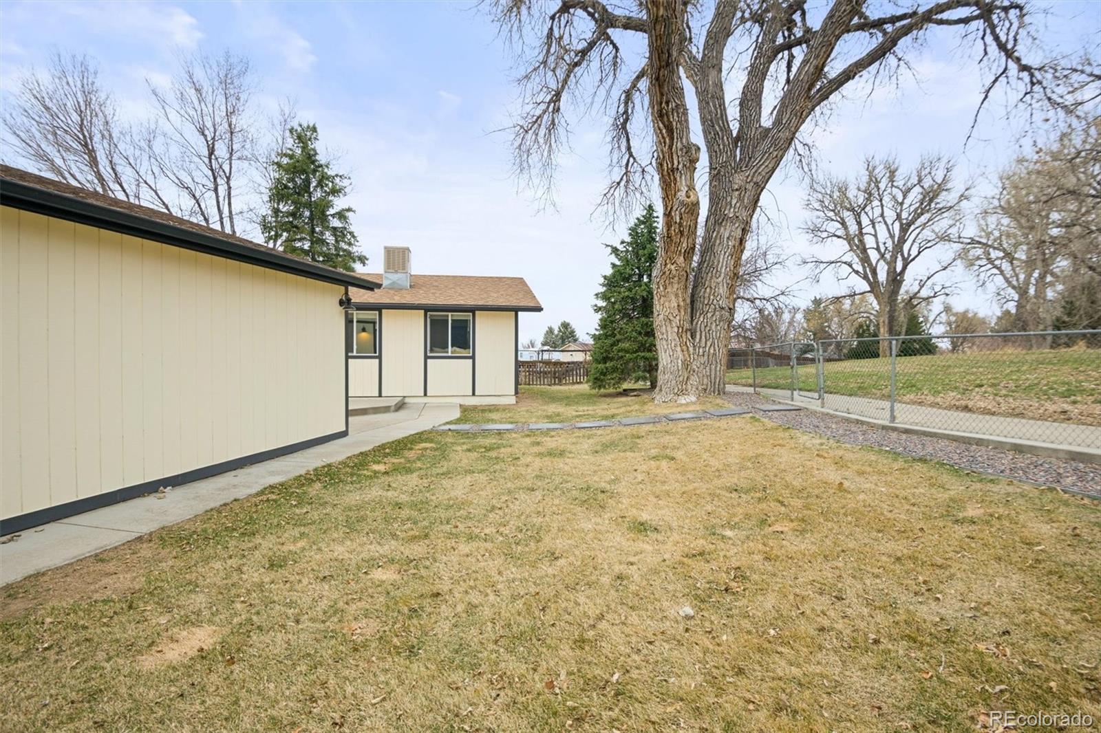 9340 Pierce Street Westminster, CO 80021 - Photo 29 of 29 a view of a house with a yard