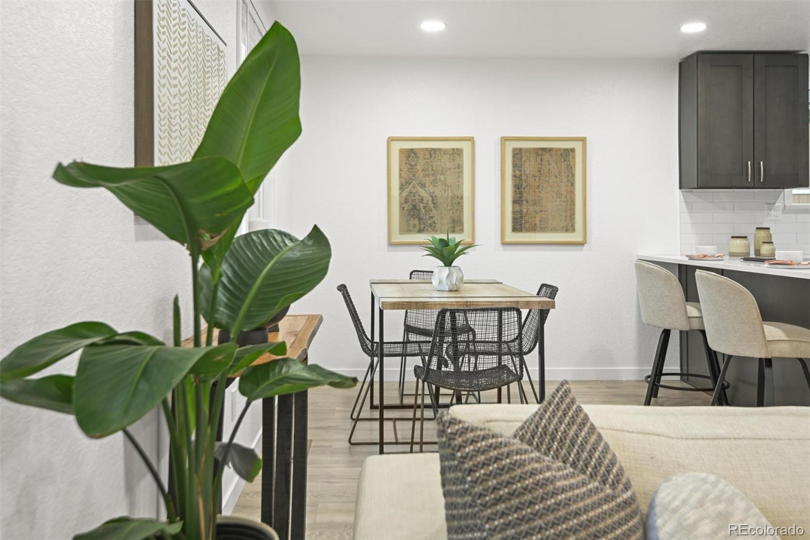 9340 Pierce Street Westminster, CO 80021 - Photo 6 of 29 a view of a dining room with furniture and a potted plant