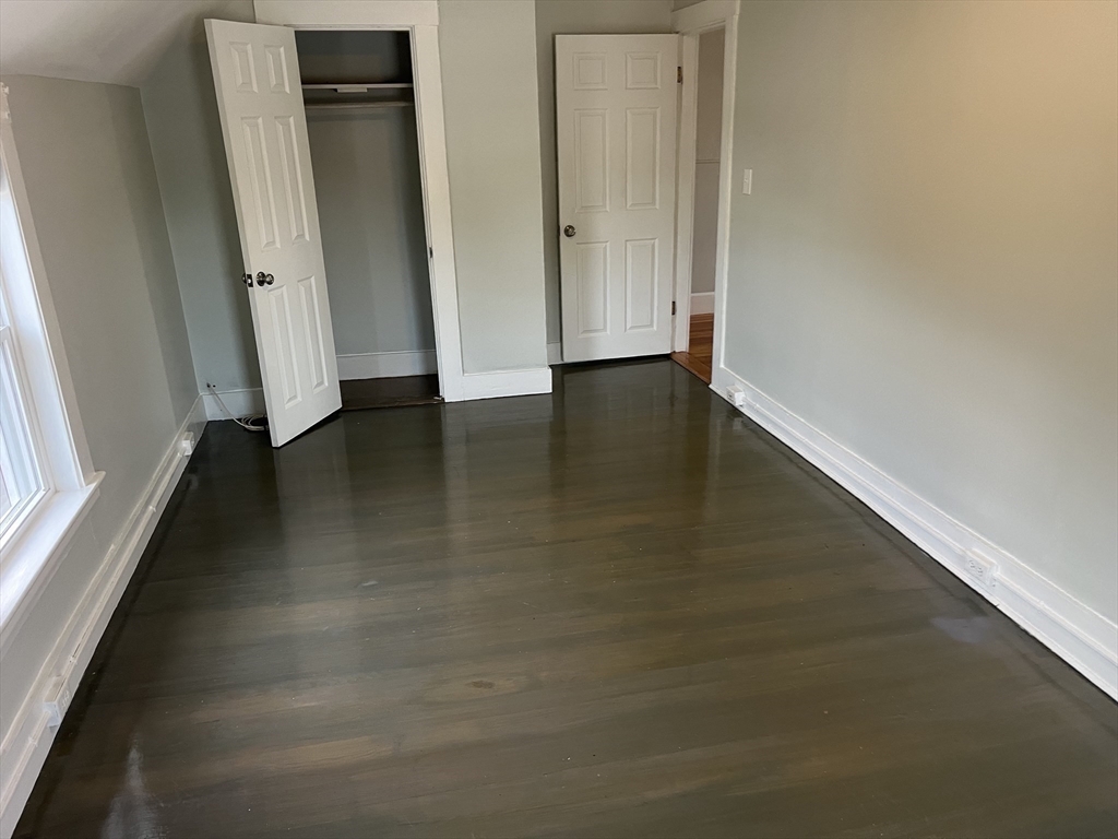 11 2nd Street, Unit 1 North Andover, MA 01845 - Photo 12 of 24 an empty room with wooden floor and windows