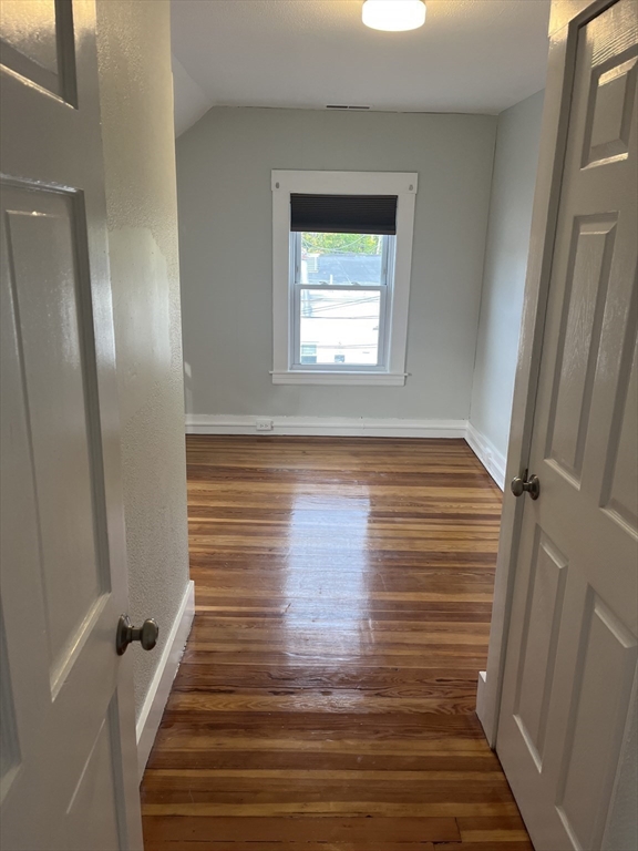 11 2nd Street, Unit 1 North Andover, MA 01845 - Photo 16 of 24 a view of a hallway with wooden floor and staircase