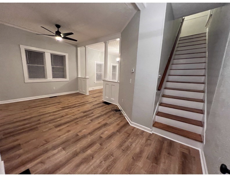 11 2nd Street, Unit 1 North Andover, MA 01845 - Photo 19 of 24 a view of a livingroom with wooden floor and stairs