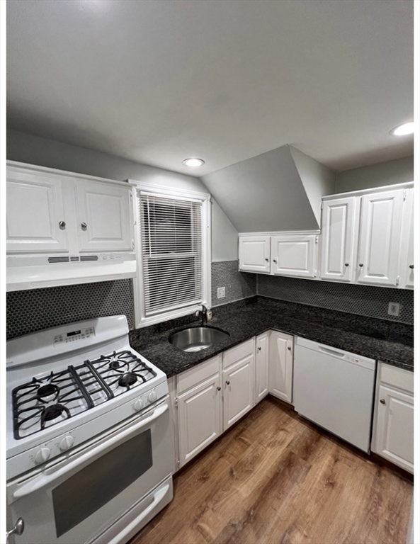 11 2nd Street, Unit 1 North Andover, MA 01845 - Photo 21 of 24 a kitchen with granite countertop a stove and a sink