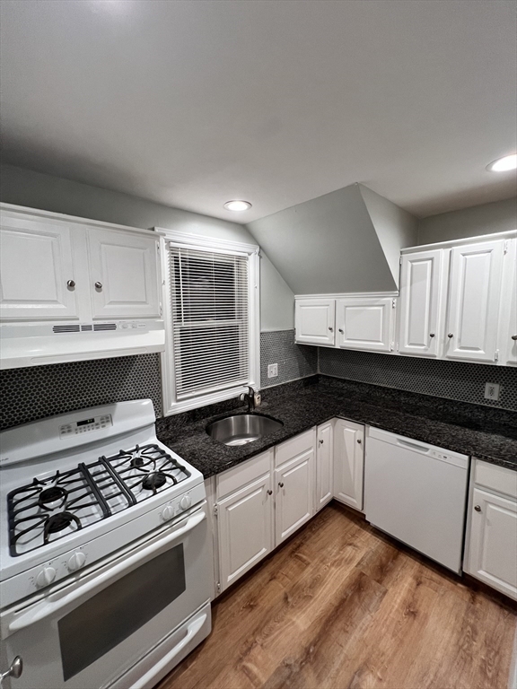 11 2nd Street, Unit 1 North Andover, MA 01845 - Photo 8 of 24 a kitchen with granite countertop a stove and a sink