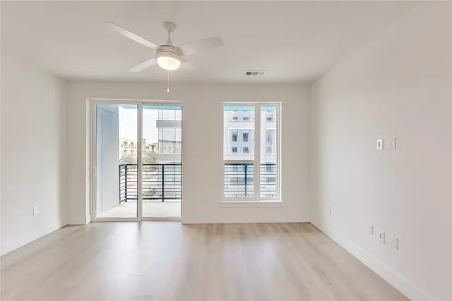 a kitchen with a refrigerator a stove a sink and a microwave