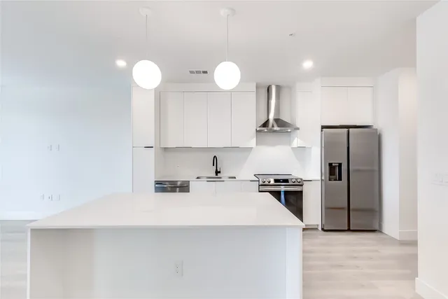 a kitchen with a stove and a sink