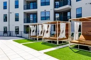 a view of a house with a yard and sitting area