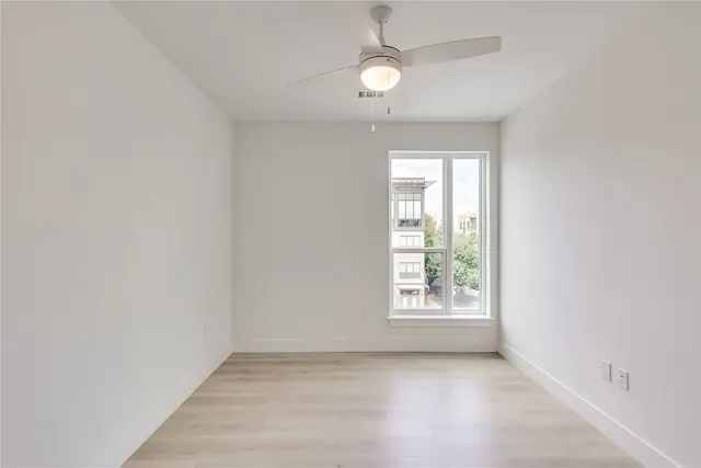 a bathroom with a tub sink mirror and toilet