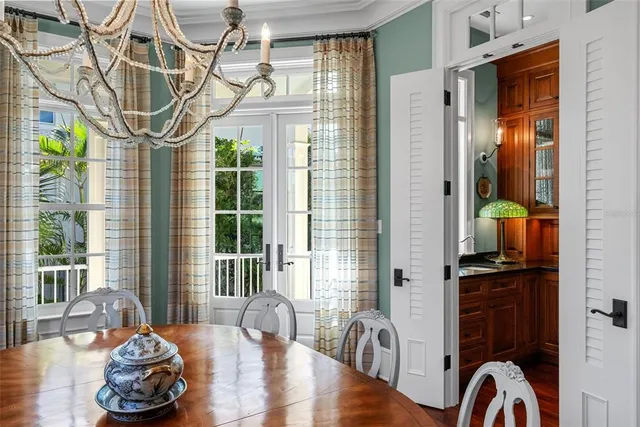 a bedroom with a balcony a bed and a large window with balcony view