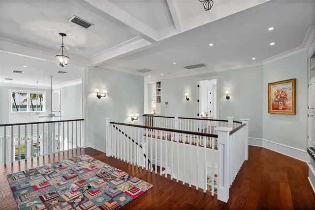 a living room with furniture gym equipment and a large window