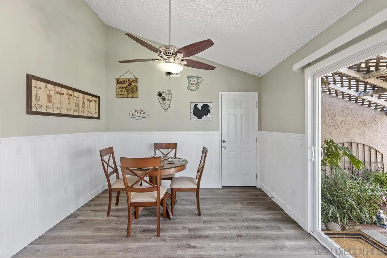 13344 Racquet Court Poway, CA 92064 - Photo 11 of 29 a view of a dining room with furniture and a chandelier