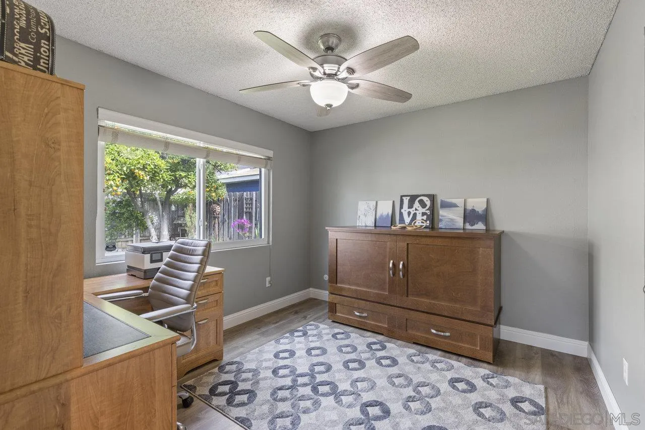 13344 Racquet Court Poway, CA 92064 - Photo 18 of 29 a bedroom with a bed and a window