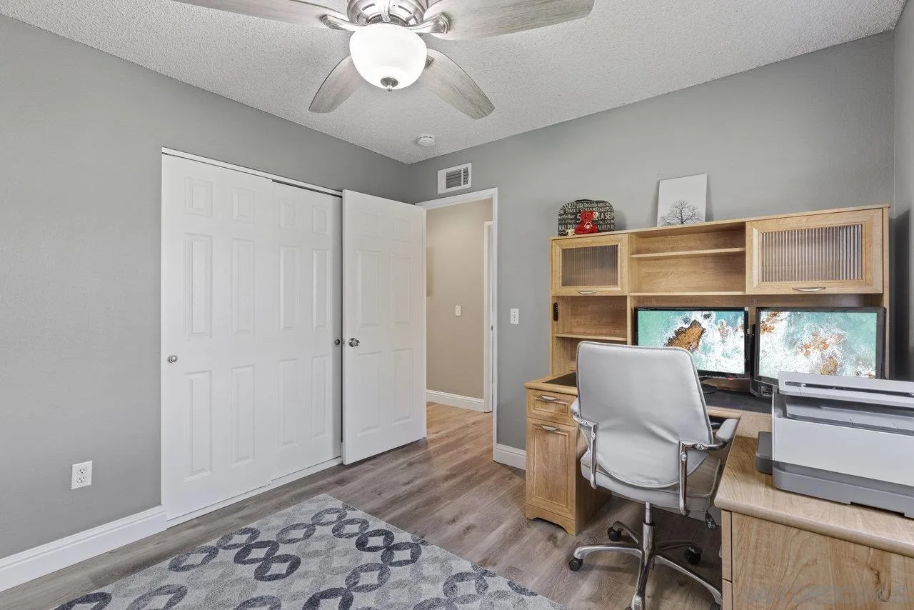 13344 Racquet Court Poway, CA 92064 - Photo 19 of 29 a living room with a couch and a window